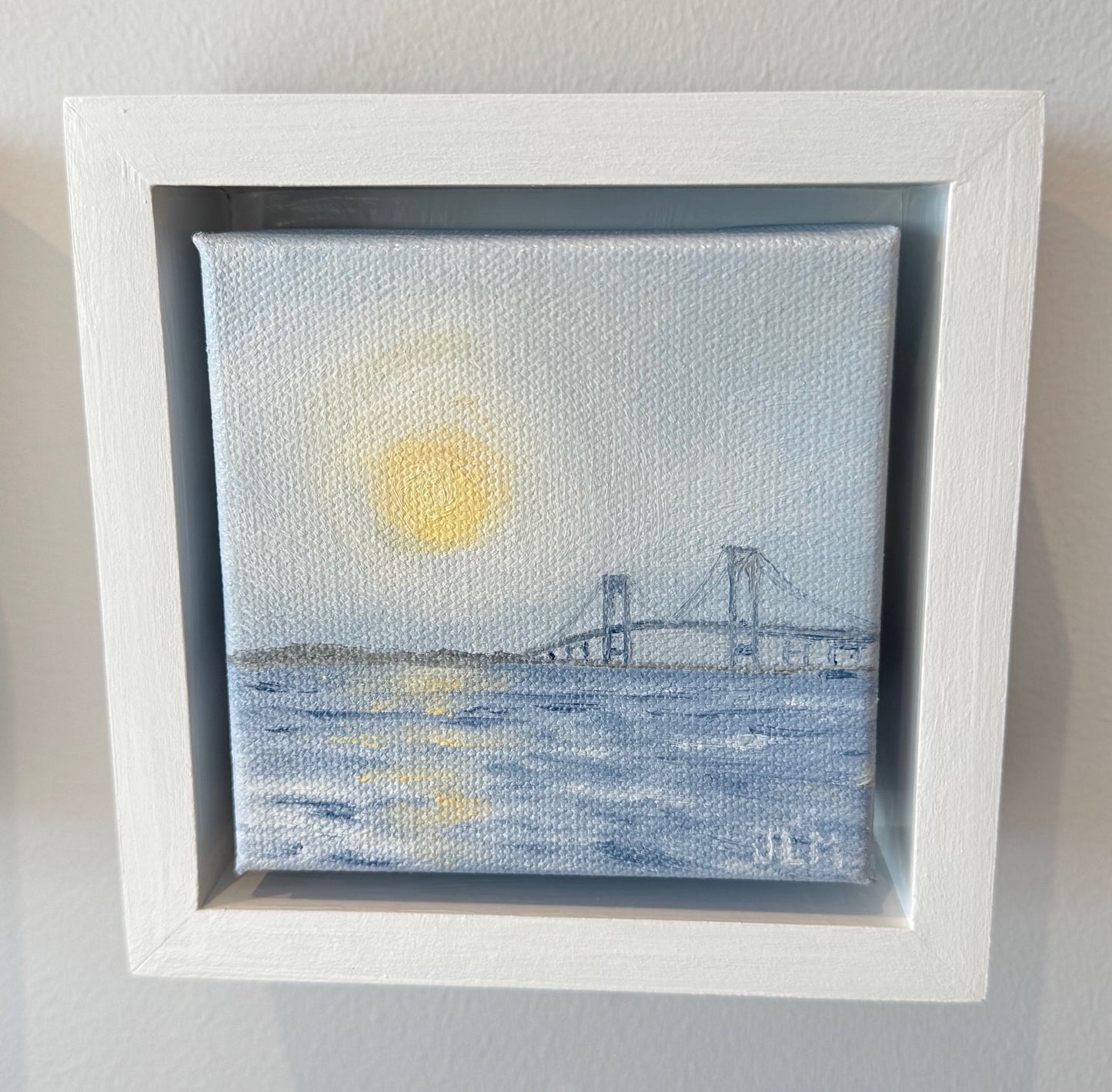 Framed artwork with a abstract design on a white wall